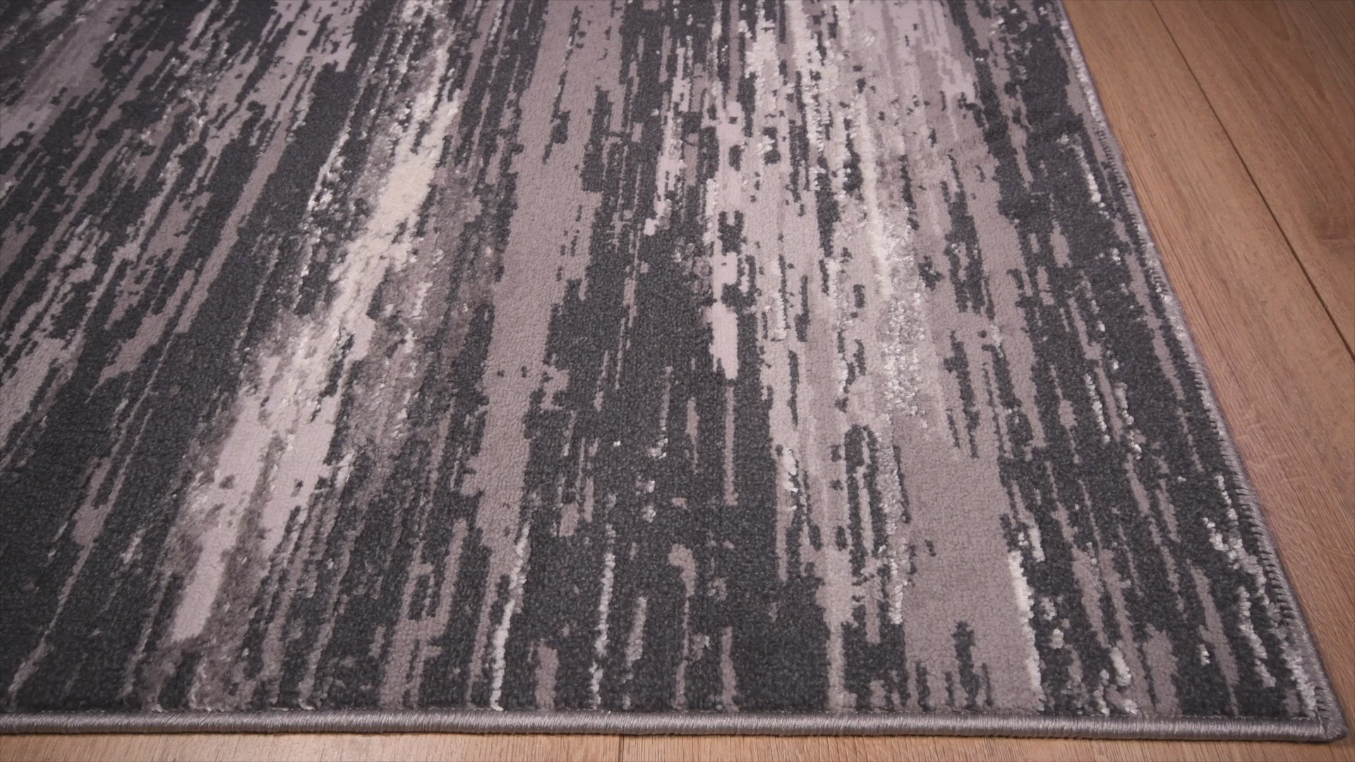 Tapete decorativo colección Jasmine U5016 rectangular de poliéster en gris negro