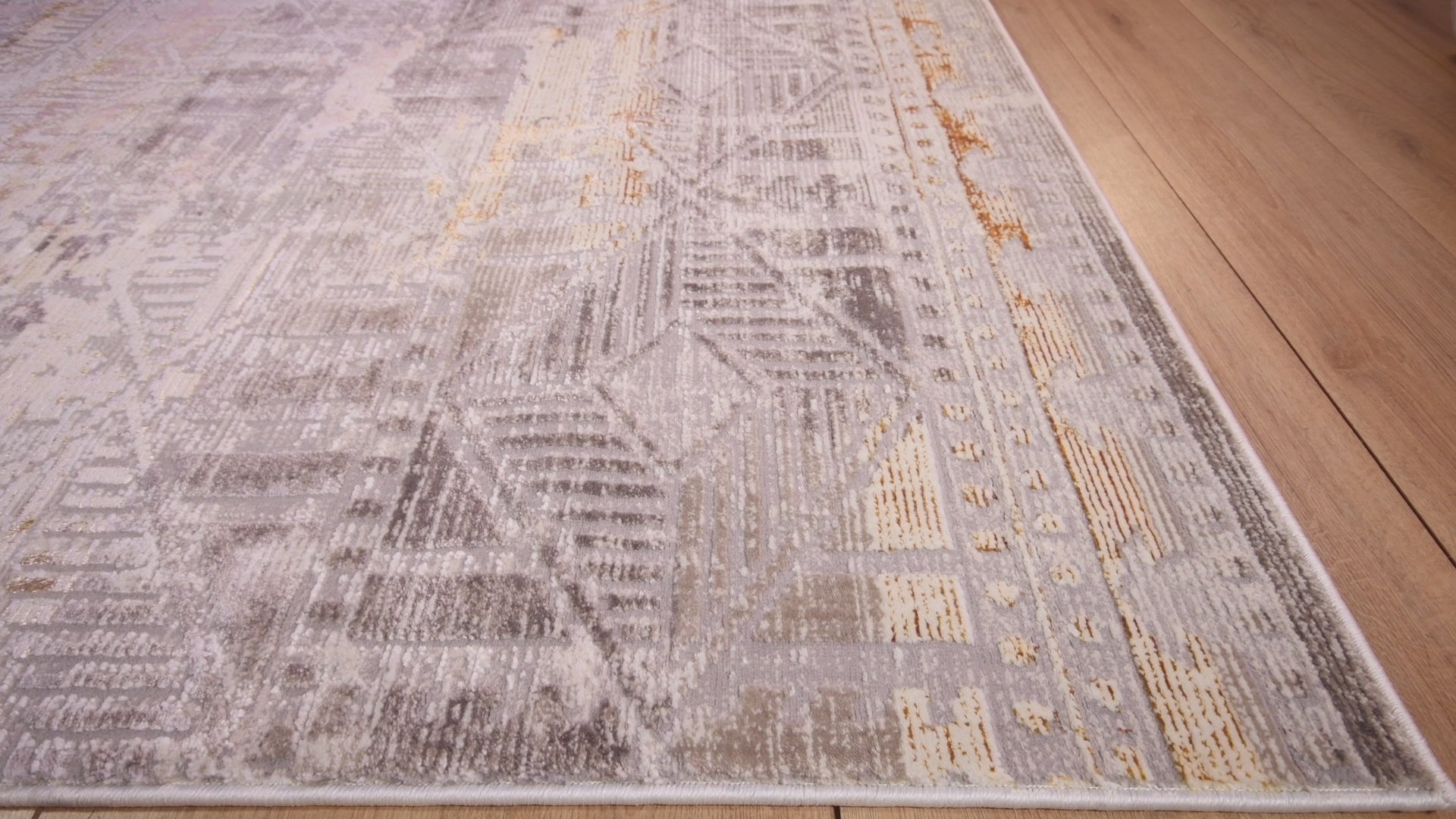 Tapete decorativo colección Elif U6035 rectangular de polipropileno y poliéster en oro taupe