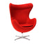 Sillón ocasional NOGAL BEAT EGG giratorio de forma envolvente, tapizado en tela con base estrella de acero.