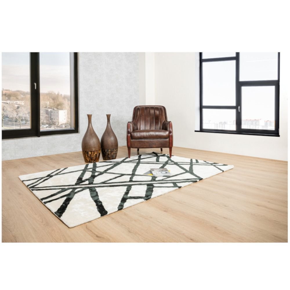 Tapete decorativo colección Gaya rectangular en viscosa y algodón marfil con negro de pelo corto