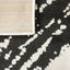 Tapete decorativo colección Optika rectangular en poliéster crema con negro de pelo corto