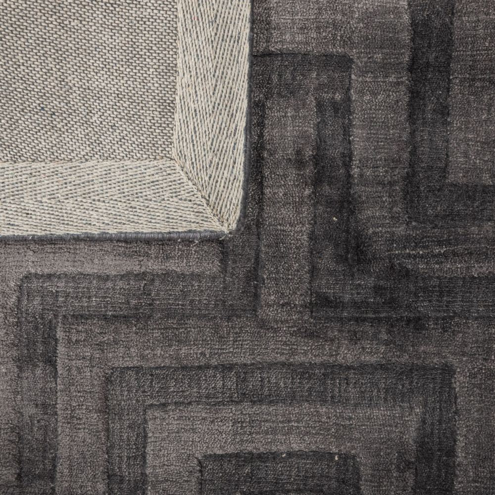 Tapete decorativo colección Raipur rectangular en viscosa y algodón gris obscuro de pelo corto