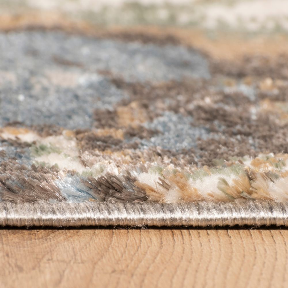 Tapete colección Zaria T2185 rectangular y circular de poliéster pelo corto en tono gris crema